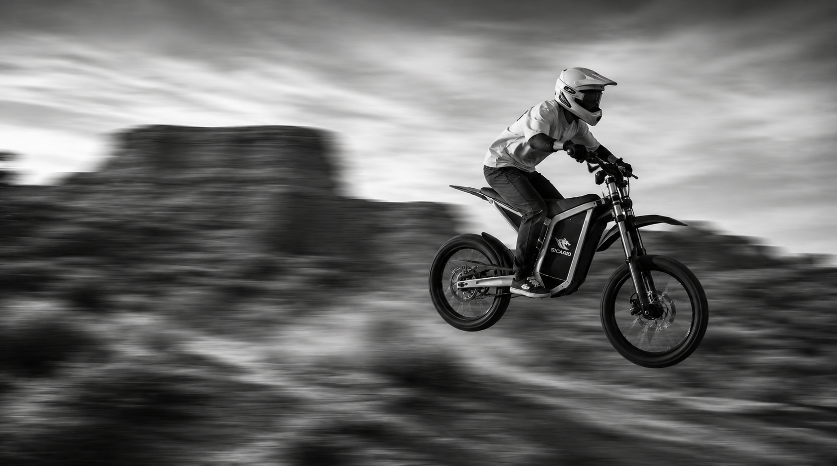 Sicario rider catching air in the desert