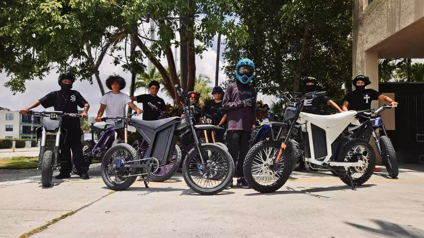 Group of riders with Sicario electric bikes lineup